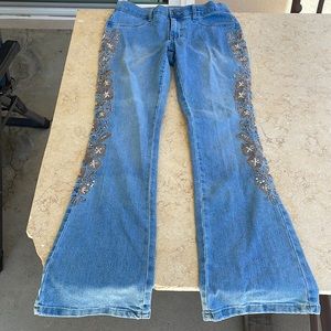 Venus light wash blue jeans with side detailing, flare like.